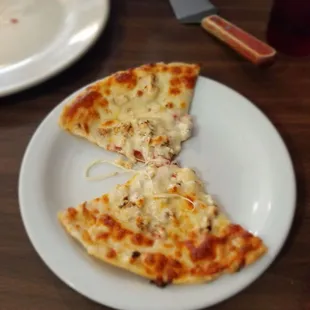 Gluten free chicken pizza with extra cheese.