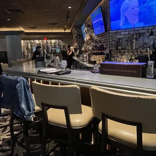 a bar with a large screen