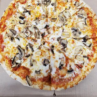 a pizza with mushrooms and cheese