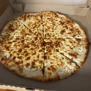 Dry not fully cooked white pizza. Was also cold.  Tasted better once we heated it up in the oven.
