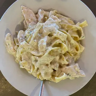 a bowl of pasta and chicken