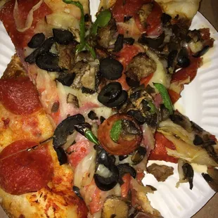 Combo pizza and pepperoni underneath.