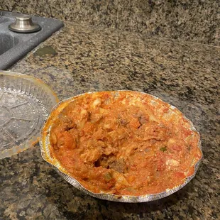 a pie in a pie tin on a granite countertop