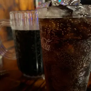 a close up of a glass of cola