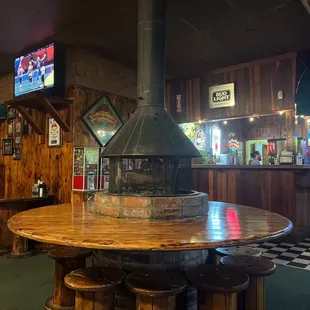 a wood table with stools