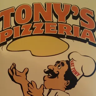 a chef tossing a pizza