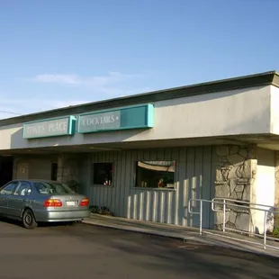 a car parked in front of the restaurant