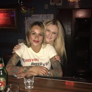 two women sitting at a bar