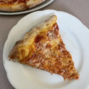 a slice of pizza on a plate