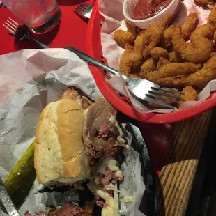 a plate of food and a basket of fried pickles