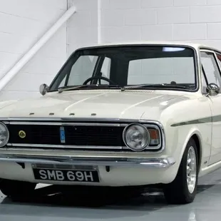 NEWTON FORREST  1970  LOTUS  CORTINA.  JAMAICA