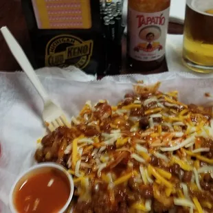 Tater tots covered with chili, cheese &amp; onions, hello?!