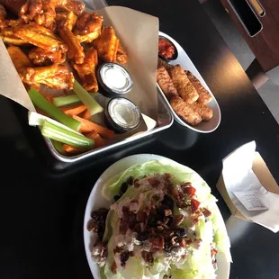 Medium wings (16) mozzarella sticks and wedge salad! Never disappointed