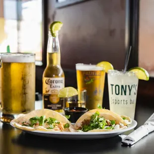 a plate of tacos and beer