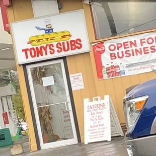 a truck parked in front of a business