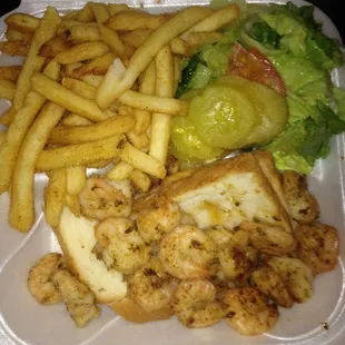 Jumbo grilled shrimp platter $14.99, though the sign says $13.99. Beneath the shrimp are 2 soggy slices of bread cut in half