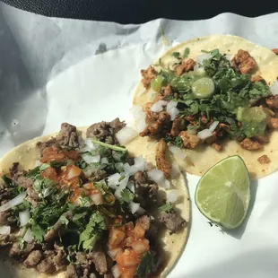 two tacos with meat and vegetables
