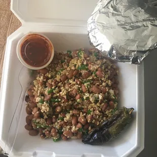 a container of beans and rice