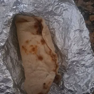 a burrito wrapped in tin foil