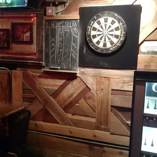 a dart board on the wall