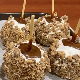 Caramel Apples dipped in White Chocolate and Peanut Butter Cups