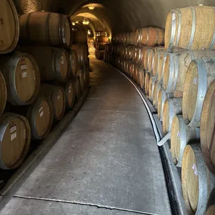 Wall of wine barrels.