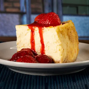 a piece of cheesecake with strawberries