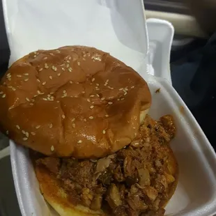 Bbq pulled pork sandwich.  Served on a grill toasted sesame bun. YUMMY !