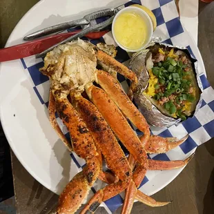 Grilled Snow Crabs - Two snow crab clusters seasoned and grilled served with a baked potato.