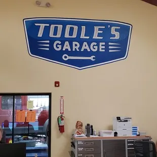 Our freshly painted wall logo from a friend and local artist!!