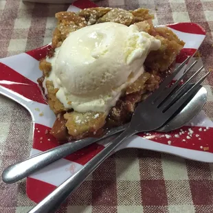 a piece of pie with ice cream on top