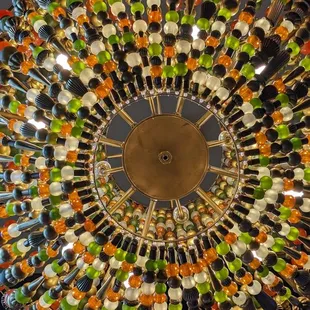 a circular chandelier made of forks and spoons