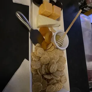 a platter of cheese and crackers