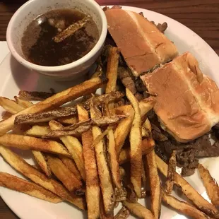 Prime rib sandwich with handmade fries and au jus