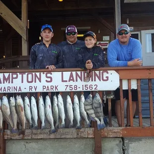 Captain Dusty with customers and their catch