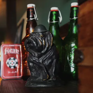  dog figurine and beer bottles