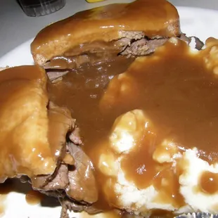 Yummy roast beef sandwich with mashed potatoes, the whole thing smothered in gravy.