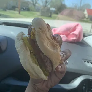 Cheeseburger with pickles, tomato, onion