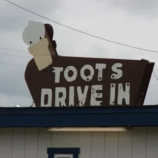 a sign for a drive - in