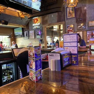 a view of a bar with a television in the background