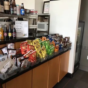 a counter full of snacks and drinks