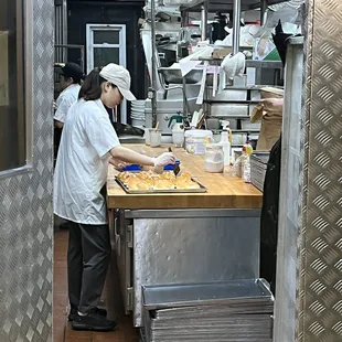 a baker in a commercial kitchen