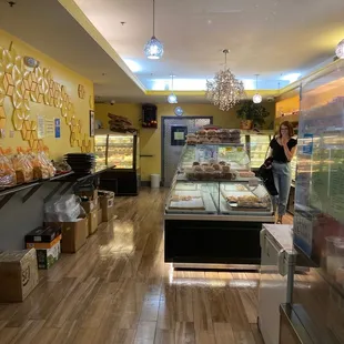 a woman standing in a bakery