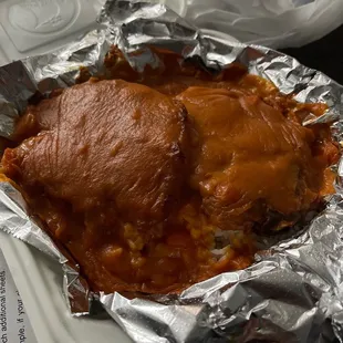 a piece of meat wrapped in tin foil