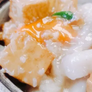 a bowl of food with meat and rice