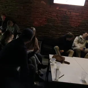 a group of people sitting around a table