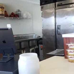a kitchen with a refrigerator and counter