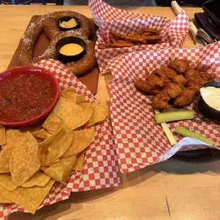 Salsa and chips, sweet fries, giant pretzel and boneless wings with mild sauce.
