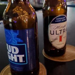 two beer bottles on a table