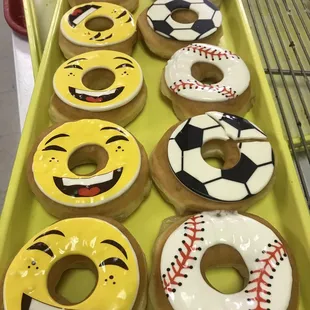 a row of doughnuts with smiley faces